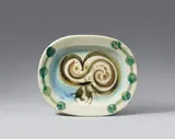 Chouette by Pablo Picasso, 1948, Ceramic plate. White clay with yellow, blue, green, and brown, engobe painting, glazed; ceramic, Madoura edition, offered May 2017