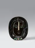 Visage de femme by Pablo Picasso, 1953, Oval ceramic plate. White clay with black, green, blue and white engobe painting, glazed and with incised decor; ceramic, offered May 2017