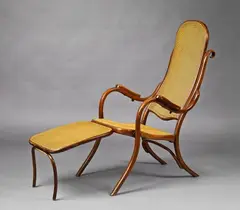 A Thonet bentwood armchair, type no. 1 by Gebrüder Thonet, Cane upholstery. Punchmarked "THONET AUSTRIA" to the apron. The footrest repaired. H 113, depth of seat 49.5 or, sold May 2017