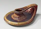 Henry van de Velde, An oxblood and transparent feldspar glazed stoneware chamberstick