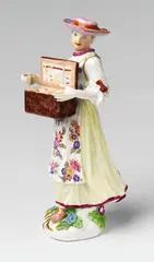 Meissen Royal Porcelain Manufactory, A Meissen porcelain figure of a Tyrolese lady selling trinkets