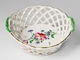 Joseph Hannong, A Strasbourg openwork faience basket with "fleurs contournées" decor