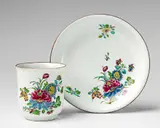 Kurmainzische Manufaktur Höchst, A rare Höchst faience cup and saucer with "indianische blumen" decor