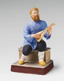 Porcelain manufactory Gardner, A Moscow biscuit porcelain figure of a peasant with a balalaika