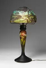 Daum Frères Nancy, A Daum Frères glass table lamp with etched Rhine river landscape decor