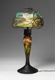 Daum Frères Nancy, A Daum Frères glass table lamp with etched Rhine river landscape decor