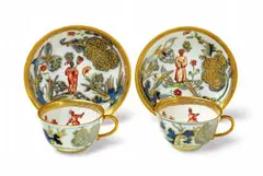 Meissen Royal Porcelain Manufactory, A pair of Meissen porcelain cups and saucers with "hausmaler" decor