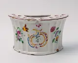 Ludwigsburg, A Ludwigsburg crescent form faience bouquetiere with overglaze decor.