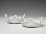 Wilhelm Caspar Wegely, A pair of white glazed Wegely porcelain fruit baskets