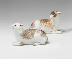 Peter Reinicke, A pair of Meissen porcelain models of recumbent sheep.