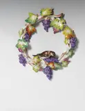 Meissen Royal Porcelain Manufactory, A Meissen porcelain vine wreath with a bird.