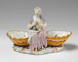 Meissen Royal Porcelain Manufactory, A Meissen porcelain salt formed as a cook with a goose.