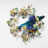 Meissen Royal Porcelain Manufactory, A Meissen porcelain wreath of apple blossom with a parrot.
