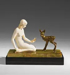 Ferdinand Preiss, A Berlin cryselephantine figure of a woman with a fawn., Ivory and patinated bronze on an onyx and black glass base. Engraved signature to the socle: "F. Preiss". H 12.6, L 16.2, D