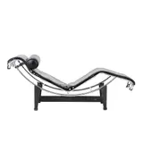 'LC4' CHAISE FOR CASSINA by Le Corbusier, Pierre Jeanneret & Charlotte Perriand, Black leather cushion and headrest with tubular chrome frame and black metal cradle. Cassina mark to frame and base, sold Nov 2025