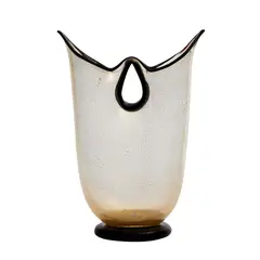 Barovier and Toso, AN ART GLASS VASE, The tick glass containing gold fleck inclusions, with a heavy black glass circular base and bat-like twin openings at the top