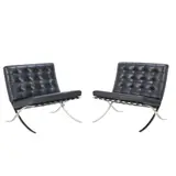 PAIR OF 'BARCELONA' CHAIRS FOR KNOLL by Ludwig Mies van der Rohe, Black leather cushions and straps on a chromed cast metal frame. Knoll tag present, sold Jul 2025