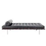 'BARCELONA' DAYBED FOR KNOLL INTERNATIONAL by Ludwig Mies van der Rohe, Black leather straps, tufted leather cushion and bolster pillow on walnut frame with tubular stainless steel legs, sold Jul 2025