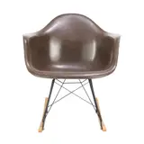 Charles and Ray Eames, 'RAR' CHAIR FOR HERMAN MILLER, Brown moulded fibreglass shell seat on chromed rod base with rubber shock mounts and rocking base. Manufacturer mark impressed to base
