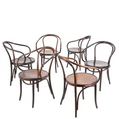 Michael Thonet, SIX 'No. B9 LE CORBUSIER' DINING CHAIRS FOR THONET, Round seats with looped steam bent beech back and armrests in dark oak stained finish. Manufacturer sticker to undersides