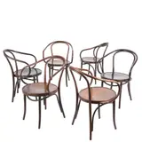 Michael Thonet, SIX 'No. B9 LE CORBUSIER' DINING CHAIRS FOR THONET, Round seats with looped steam bent beech back and armrests in dark oak stained finish. Manufacturer sticker to undersides
