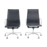 PAIR OF 'GROUP MANAGEMENT' CHAIRS FOR HERMAN MILLER by Charles and Ray Eames, High back aluminium and steel frame with ribbed black leather upholstery on five star swivel castor base. Height and til, sold Jul 2025
