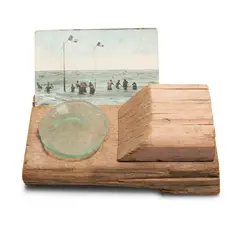 Seaside 1976 vintage postcard, weathered painted wood, weathered glass 12 x 20 x 14cm by Rosalie Gascoigne, 1976, vintage postcard, weathered painted wood, weathered glass, sold Sep 2025
