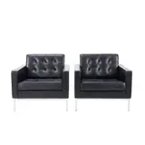 PAIR OF LOUNGE CHAIRS FOR KNOLL by Florence Knoll, Square form structure in black leather button back upholstery on chrome steel base, sold May 2025