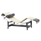 / CHARLOTTE PERRIAND LC4 CHAISE FOR CASSINA by Le Corbusier and Pierre Jeanneret, Ecru canvas and black leather with tubular chrome frame and black metal cradle. Cassina mark to base. Manufactured c 198, sold Nov 2024