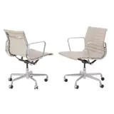 Charles and Ray Eames, PAIR OF 'EA335' GROUP MANAGEMENT CHAIRS FOR HERMAN MILLER, Aluminium and steel frames with ribbed ecru vinyl upholstery. Adjustable tilt and height on five star swivel castor bases