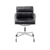 'SOFT PAD' CHAIR FOR HERMAN MILLER by Charles and Ray Eames, Black padded leather over an aluminium and metal frame on four point fixed height swivel castor base. Herman Miller mark, sold Feb 2025