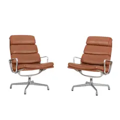 A PAIR OF EA216 SOFT PAD LOUNGE CHAIRS FOR HERMAN MILLER by Charles and Ray Eames, sold Jul 2024
