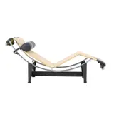 / CHARLOTTE PERRIAND LC4 CHAISE FOR CASSINA by Le Corbusier and Pierre Jeanneret, Ecru canvas and black leather with tubular chrome frame and black metal cradle. Cassina mark to base. Manufactured c 198, sold Apr 2024