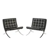 A PAIR OF BARCELONA CHAIRS FOR KNOLL by Ludwig Mies van der Rohe, Black leather cushions and straps on chromed cast metal frames, sold Apr 2024