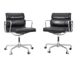 Charles and Ray Eames, A PAIR OF SOFT PAD SIDE CHAIRS FOR HERMAN MILLER, Black leather over aluminium and metal frames. Five point swivel bases with castors. Stamped to undersides