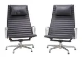 Charles and Ray Eames, PAIR OF EA124 GROUP LOUNGE CHAIRS FOR HERMAN MILLER, Black ribbed vinyl, polished aluminium base