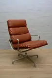 Charles and Ray Eames, GROUP CHAIR IN TAN LEATHER FOR HERMAN MILLER WITH BRUSHED ALUMINUM FOUR STAR BASE (91CM H X 64CM W X 78CM D )