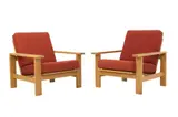 PAIR OF ARMCHAIRS FOR GETAMA by Hans J. Wegner, Solid oak and veneered frames with rust coloured Danish wool fabric cushions, sold Nov 2021