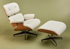 '670' LOUNGE CHAIR & '671' OTTOMAN FOR HERMAN MILLER by Charles and Ray Eames, Cream leather and walnut shell, sold Jul 2019