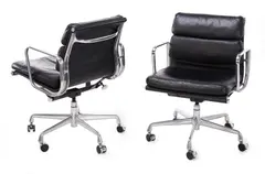 'SOFT PAD' CHAIRS FOR HERMAN MILLER by Charles and Ray Eames, Black leather, polished aluminium , on casters, sold Jul 2019