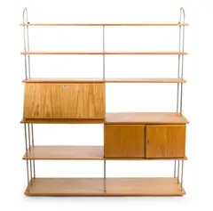 STORAGE UNIT by Charles and Ray Eames, Oak and metal frame with sectional shelving, sold Jul 2017