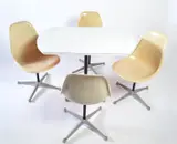 Laminated table and four swivel chairs by Charles and Ray Eames, Fibreglass and aluminium, sold Dec 2015