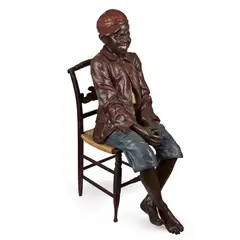 Friedrich Goldscheider, FIGURE OF A SEATED BOY, CIRCA 1900, 1900, polychrome-decorated terracotta