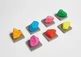 Seven Small Mountains by Ugo Rondinone, 2016, painted stone on concrete base, in 14 parts, offered May 2018