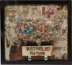 Greg Haberny, Recycled Nation, 2010, found newspaper, recycled plastic, glitter, glue, metal brackets, screws and gold letters on wood, in artist's frame