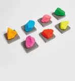Seven Small Mountains by Ugo Rondinone, 2016, painted stone on concrete base, in 14 parts, sold Nov 2018