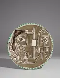 Jacqueline at the Easel (Jacqueline au chevalet) by Pablo Picasso, 1956, White earthenware round plate, painted in colors with brushed glaze; ceramic, Madoura edition, sold Apr 2018