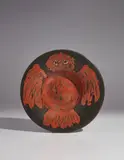 Pablo Picasso, Red owl on black ground (Hibou rouge sur fond noir), 1957, Red earthenware round dish painted in colors, with knife engraving and engobe decoration under glaze