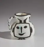 Square-headed pitcher (Pichet tête carrée) by Pablo Picasso, 1953, White earthenware pitcher, painted in white and black; ceramic, Madoura edition, sold Apr 2018
