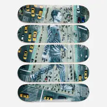 JR, Migrants, Walking New York City, New York, USA, 2015 skateboard decks, 2019, offset lithograph in colors on skate deck in five parts